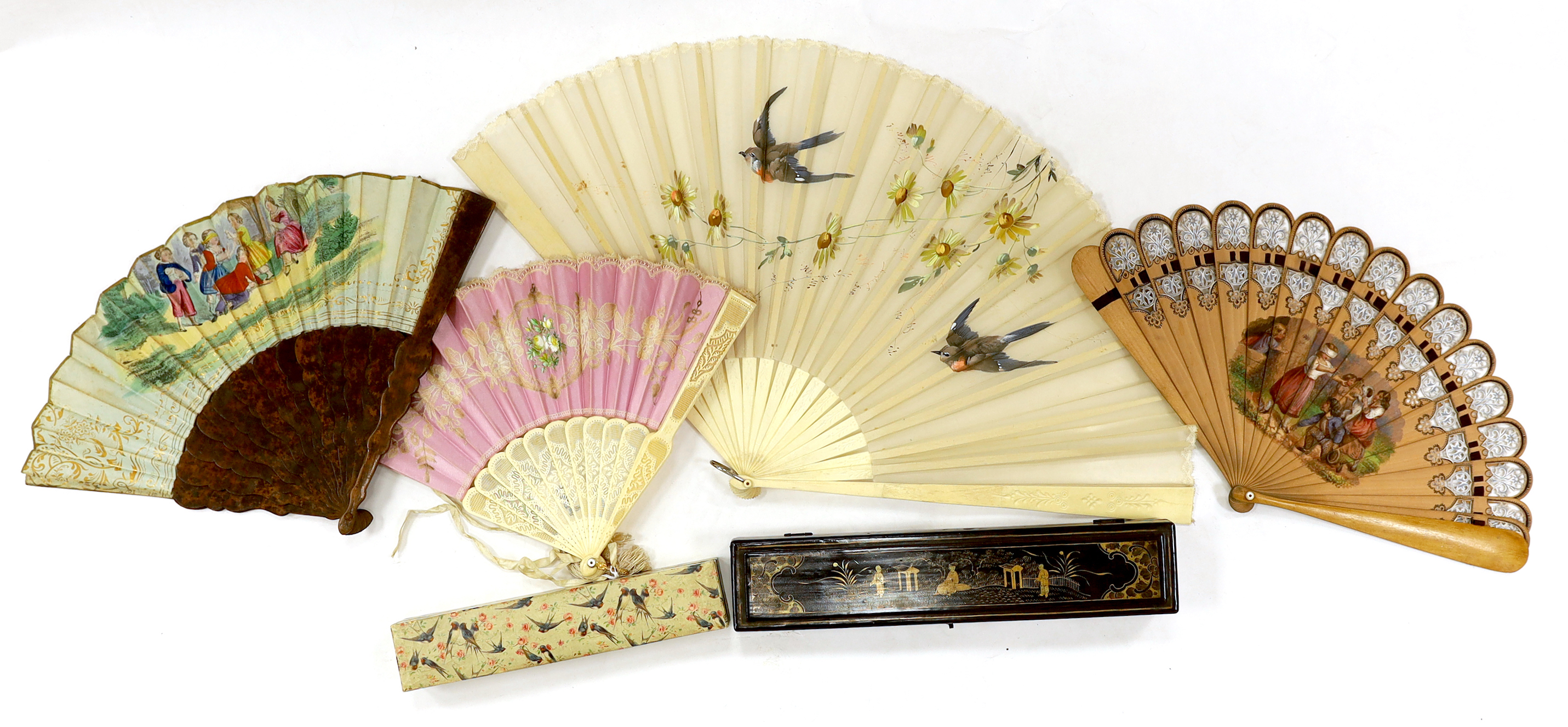 A Chinese lacquer fan box and a paper covered fan box, two Victorian fans painted with scenes of children playing, a gauze painted fan and another with bobbin lace appliqué, lacquer box 32cm wide x 4.5cm high